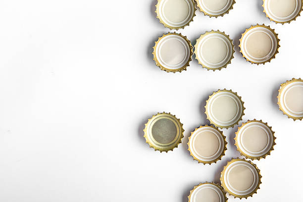 caps of beer on white background, there is a place for an inscription, top view