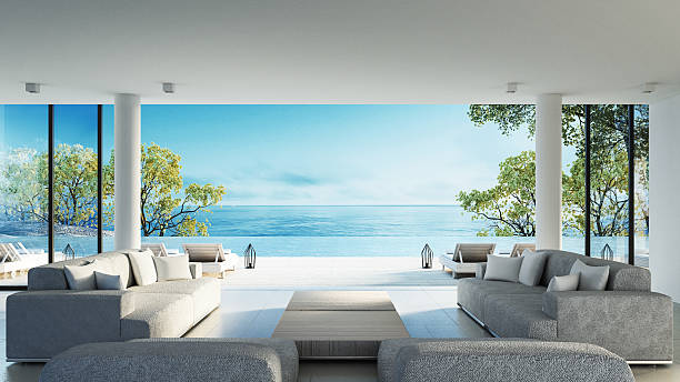 soggiorno sulla spiaggia con vista sul mare - contemporary indoors lifestyles domestic room foto e immagini stock