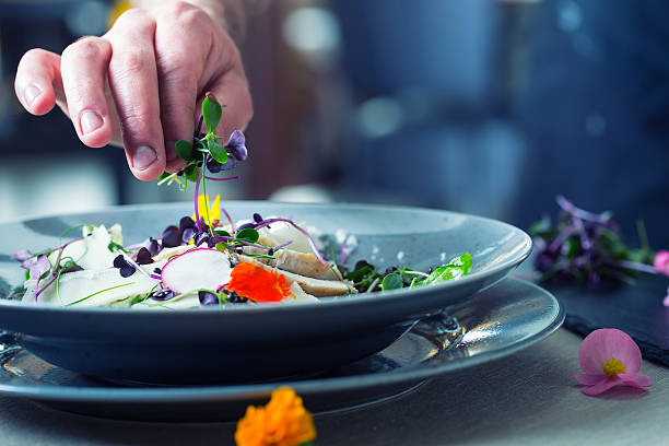 istock Chef in restaurant kitchen cooking. Preparing vegetable salad 528488812