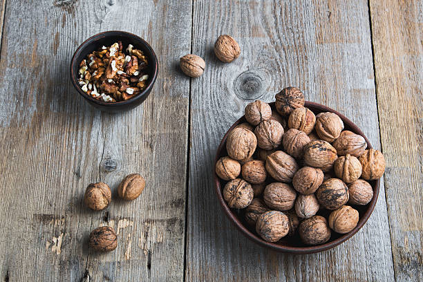 istock walnuts in a bowl on a wooden background 528489176