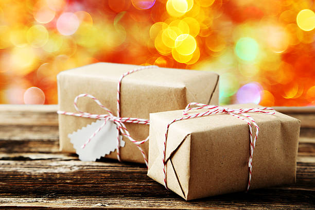 istock Beautiful gift boxes on brown wooden background 528489546
