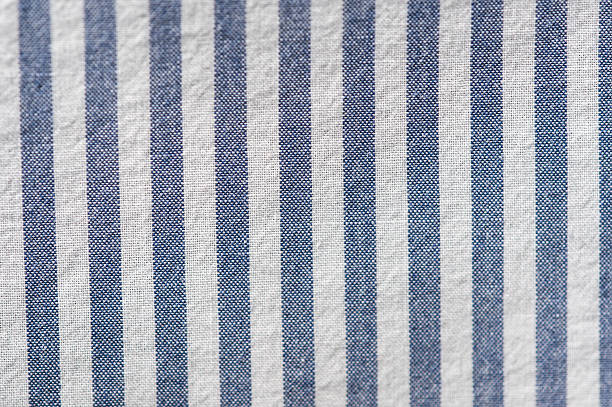 istock Textile background from a fabric with blue and white stripes 528489828