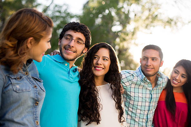 istock Group of latin friends looking at each other 528489834
