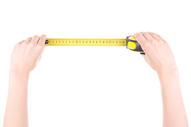 istock woman hands with measuring tape isolated on white 528491400