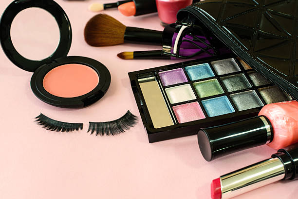 istock make up with cosmetics and brushes isolated on pink background 528491814