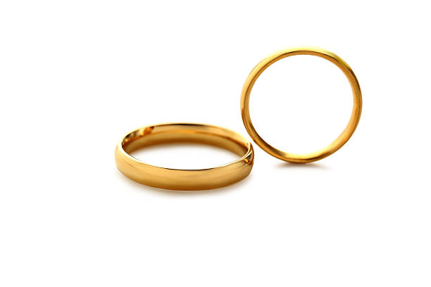 Golden wedding rings isolated on a white stock photo
