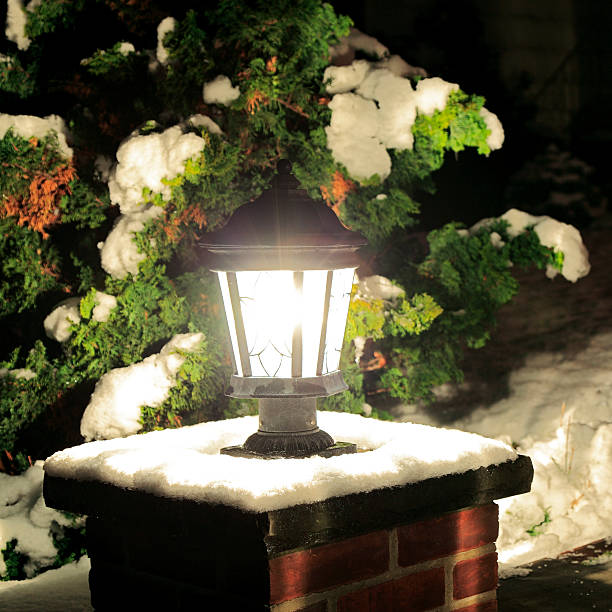 istock Electric lantern shining brightly in winter snow 528494389