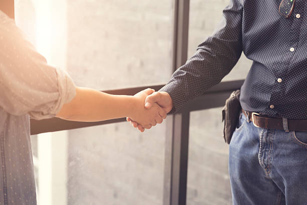 istock businessman handshaking for business acquisiton concept 528494714