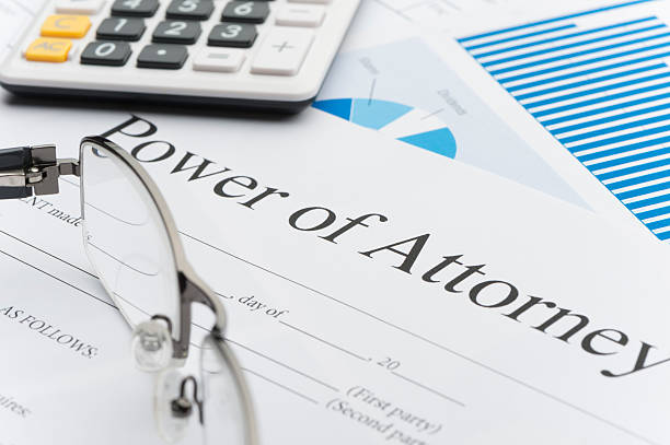 istock Blank power of attorney form with paperwork. 528495633