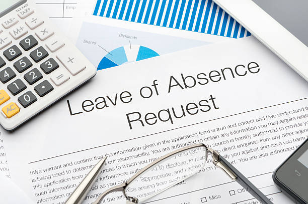 istock Leave of absence request form on a desk with paperwork 528495661