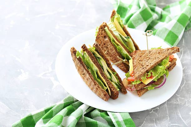 istock Tasty and fresh sandwiches on a grey table 528495748