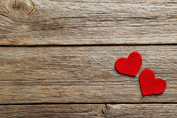 istock Red hearts on a grey wooden table 528495960