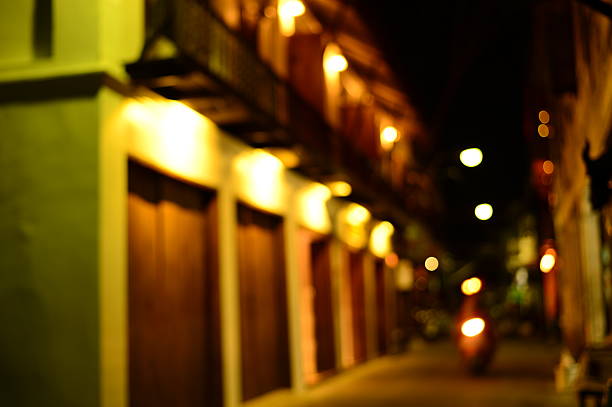 istock blur old building on small street at night 528496021
