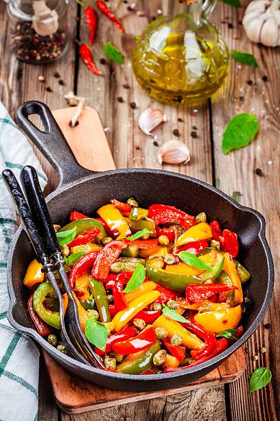 istock Italian cuisine, peperonata: roasted bell pepper with capers and basil 528496228