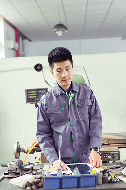 istock mechanic  worker using tablet in workshop of factory 528496971