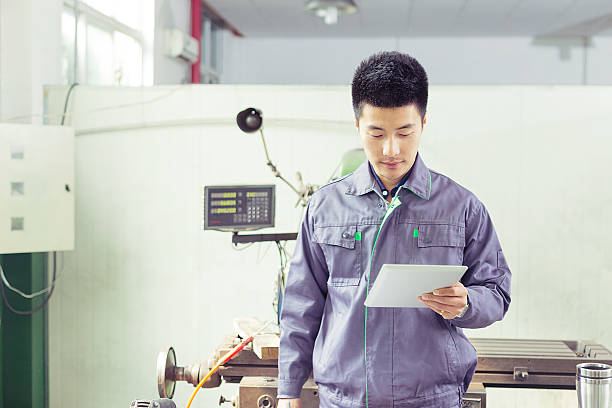 istock mechanic  worker using tablet in workshop of factory 528497103