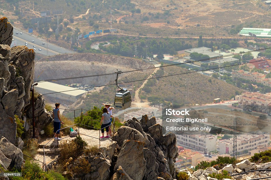 Cableway Tourists Malaga, Spain - August 10, 2012: Unidentified tourists hiking in Calamorro mountain. The cableway reach the summit of the Calamorro Mountain at nearly 800 meters above sea level, the highest spot in Benalmadena. Andalusia Stock Photo