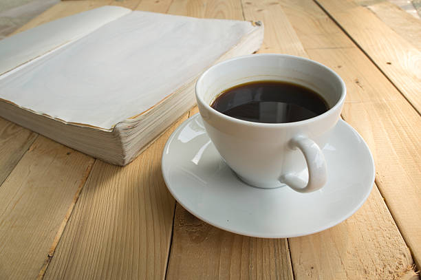 istock cup of coffee morning with book 528497254