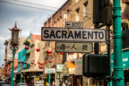 March 19, 2023: view of Chinatown in San Francisco, California with tourists walking, colourful authentic traditional decorations, stores and restaurants
