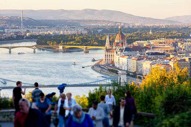 Look-out point at Citadella in Budapest at sunset, with the Hungarian Parliament Building and the Chain Bridge.