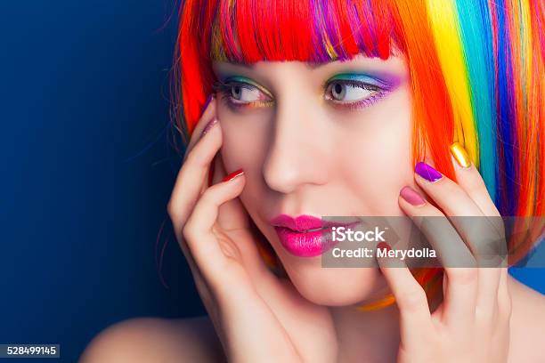 Beautiful Woman Wearing Colorful Wig And Showing Colorful Nails Stock Photo - Download Image Now