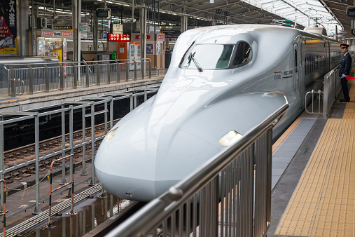 Osaka, Japan - November 1, 2014: A Shinkansen bullet train train arriving at the Shin Osaka Station in Osaka, Japan. The Shinkansen is a netwrok of high-speed railway lines in Japan.