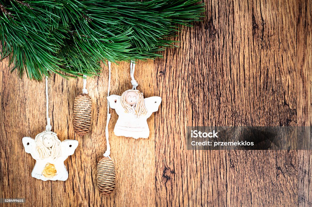 Christmas decoration Christmas decoration - pine twigs, earthen crafts on wooden background. Space for text Christmas Stock Photo