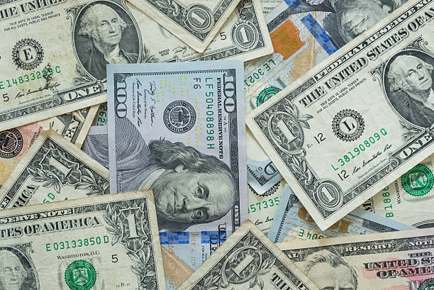 istock variety of dollar bills background 528500013