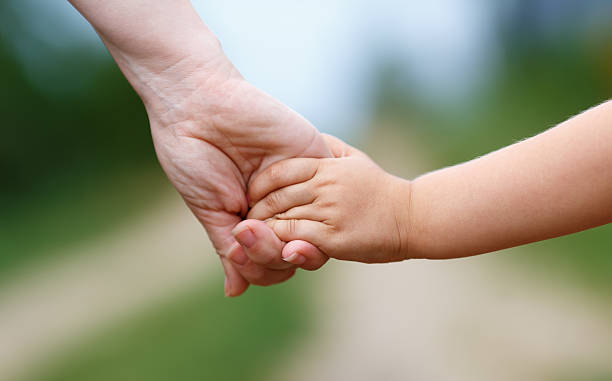istock Women's and children's hands 528500225