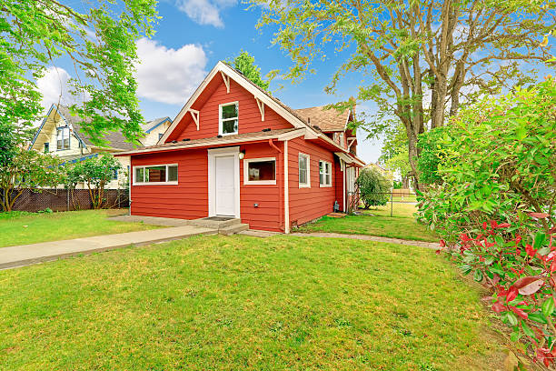 istock Small coutnryside house exterior in bright red color 528500347