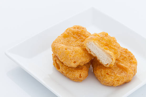 istock Group of fried chicken nuggets i on white dish 528500577