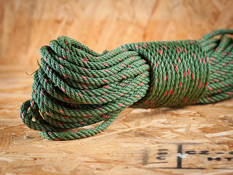 Green rope on wood