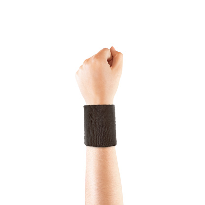 Blank black wristband mockup on hand, isolated. Clear sweat band mock up design. Sport sweatband template wear on wrist arm. Sports support protective bandage wrap. Bangle on the tennis player hand.