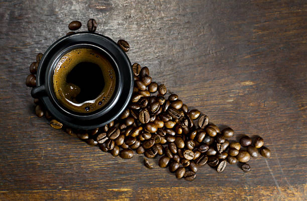 istock Cup of hot coffee on wooden background 528503548