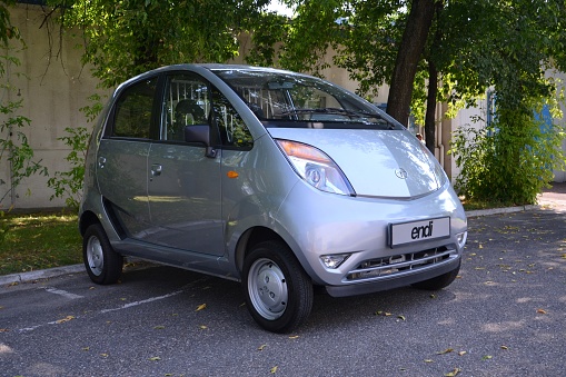 Warsaw, Poland - July 6th, 2012: Tata Nano parked on the street. Tha Nano model is one of the cheapest car in the world.