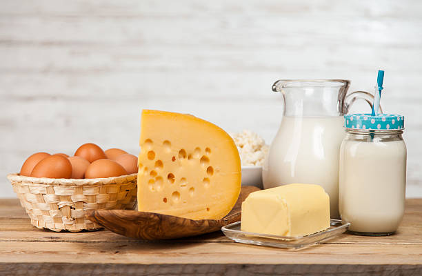 istock Milk jar on wooden table 528503736