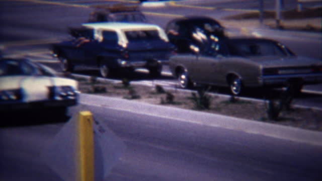 1972: Parade of little league baseball players driving to tournament.