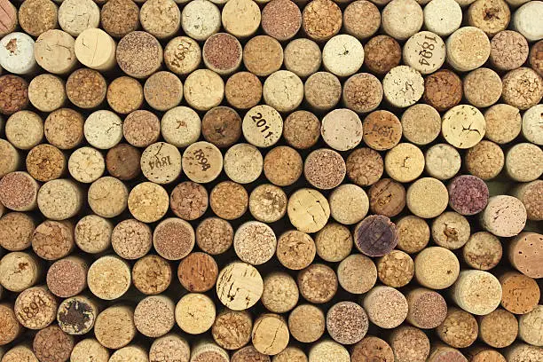 Photo of many different wine corks in the background