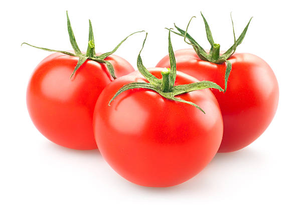 istock three fresh tomatoes with green leaves isolated on white backgro 528529851