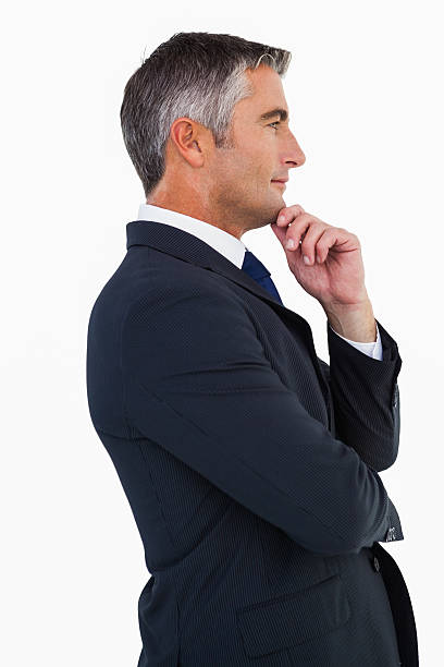 istock Elegant businessman in suit posing 528530475