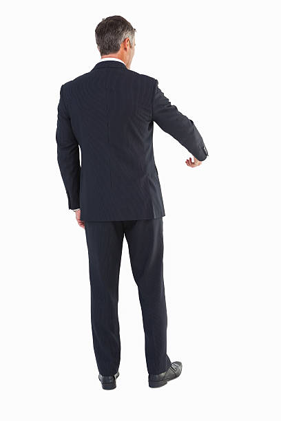 istock Rear view of a businessman doing gesture 528530491