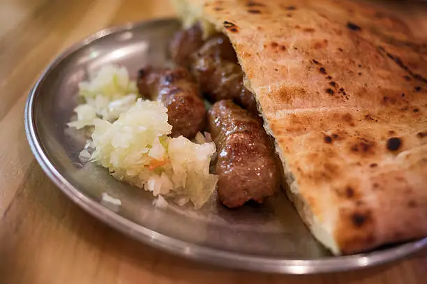 Cevapi or cevapcici is a grilled dish of minced meat, a type of kebab, found traditionally in the countries of southeastern Europe (the Balkans). It's considered a national dish in Bosnia and Herzegovina.