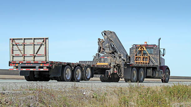 istock Semi Flatbed Truck With Boom Lift 528532203