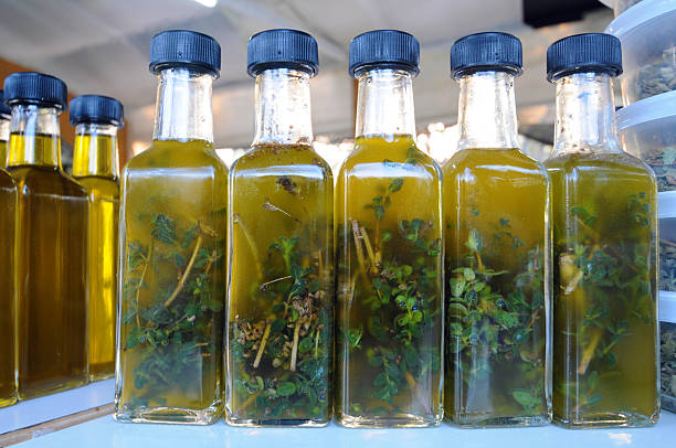istock Olive oil with herbs in bottles 528532397