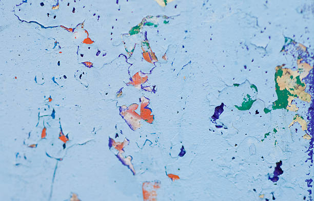 istock Wall with several layers of paints and holes on it 528532435