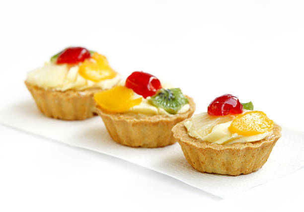 istock delicious fresh fruit tarts with focus in front 528533325