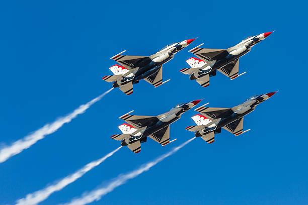USAF Thunderbirds perform air show routine Las Vegas, USA - November 8, 2014: USAF Thunderbirds perform air show routine during Aviation Nation at Nellis AFB on November 8,2014 in Las Vegas,NV. Squadron is the official air demonstration team for the USAF.  supersonic airplane photos stock pictures, royalty-free photos & images