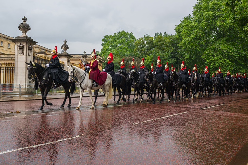 London, United Kingdom - June 7, 2014: Queen's cavalry guards march in front of Buckingham palace to Celebrate Queen's Official Birthday