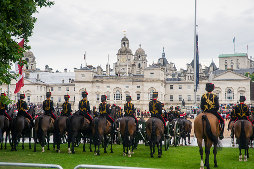 London, United Kingdom - June 7, 2014: Queen's cavalry guards march in front of Buckingham palace to Celebrate Queen's Official Birthday