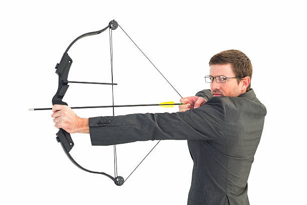 istock Businessman shooting a bow and arrow 528534249